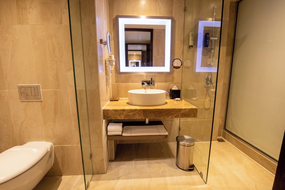 Shower, rainfall showerhead, designer toiletries, hair dryer