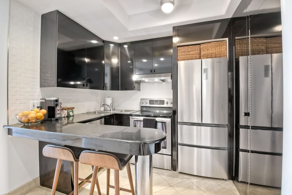 Full kitchen features a Keurig with complimentary K-cups, creamer, and sugar.
