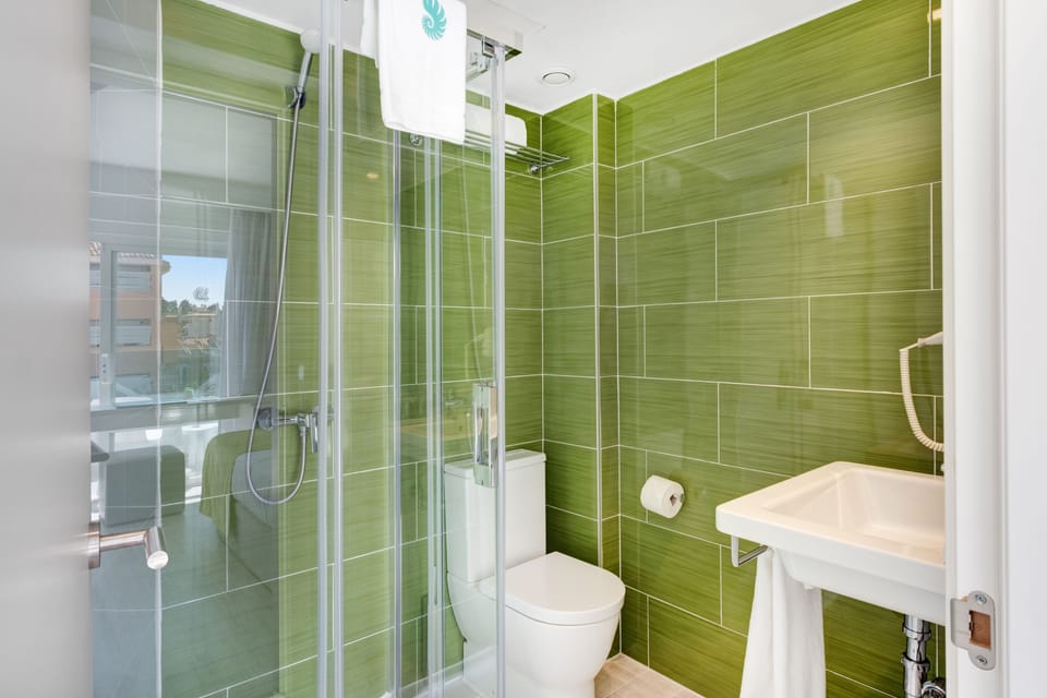 Shower, free toiletries, hair dryer, bathrobes