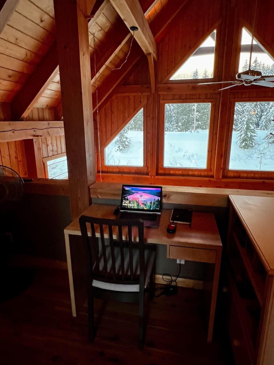 Desk and chair set up on upper landing to work remotely