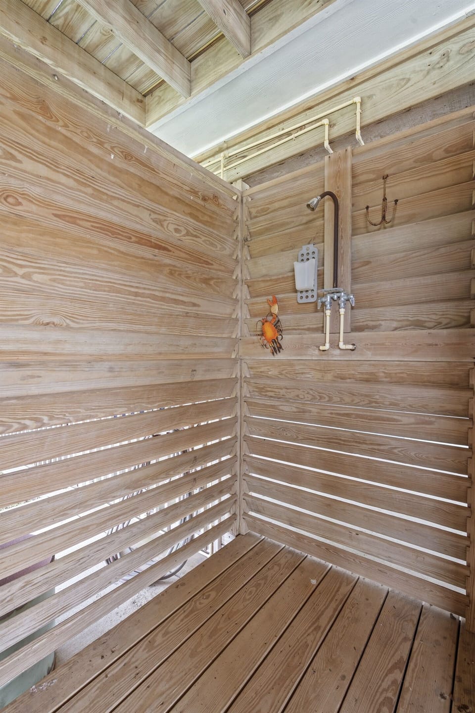 Outdoor shower under the deck