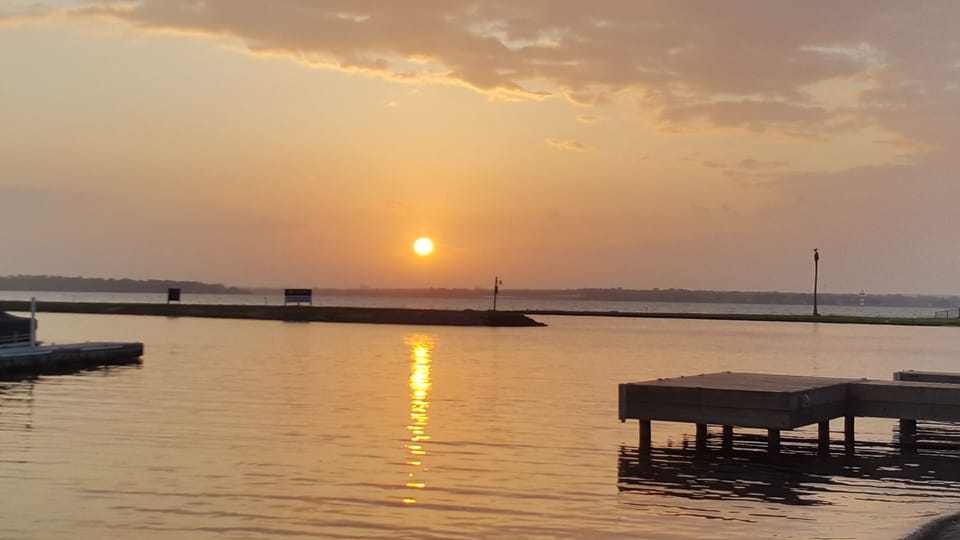 Gorgeous sun rise from Safe Harbor which is 100 ft. from the unit.