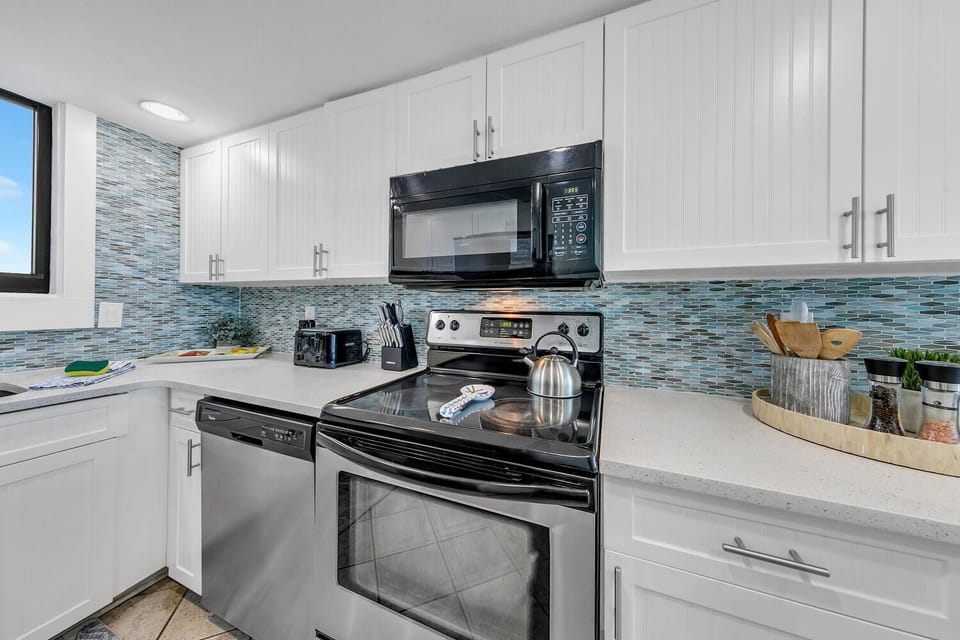 Your fully equipped kitchen features modern appliances and sleek design, perfect for preparing meals during your stay.