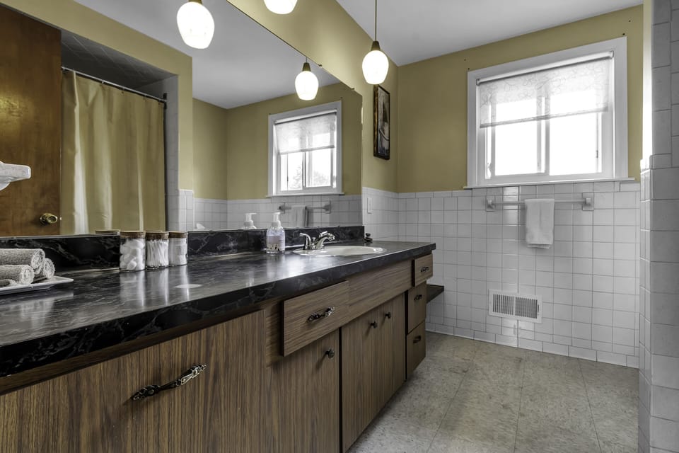 Large bath is clean, has great water pressure and is equipped with essentials.