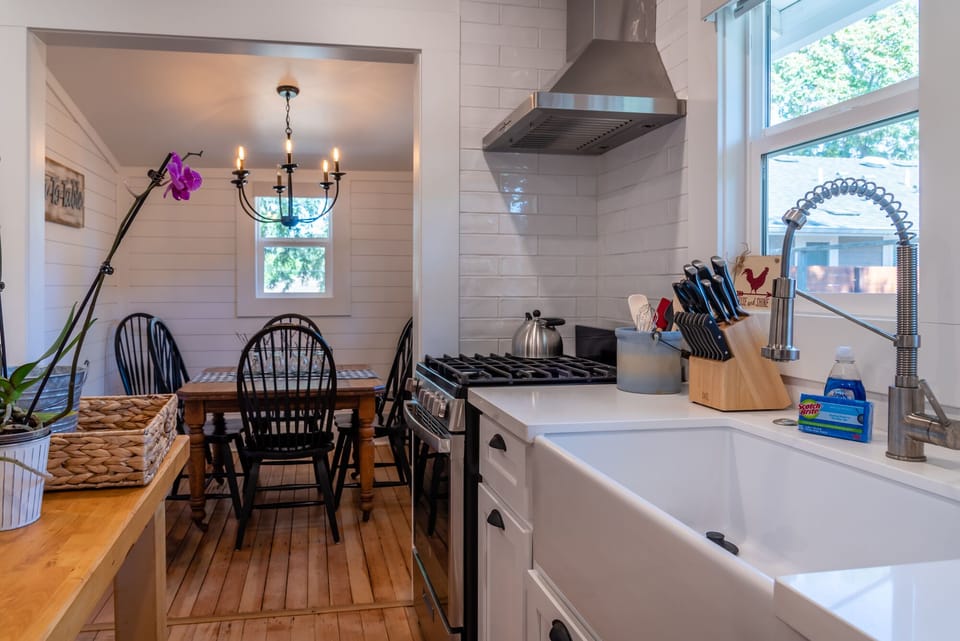 Gather in the kitchen at the table beside the gas range