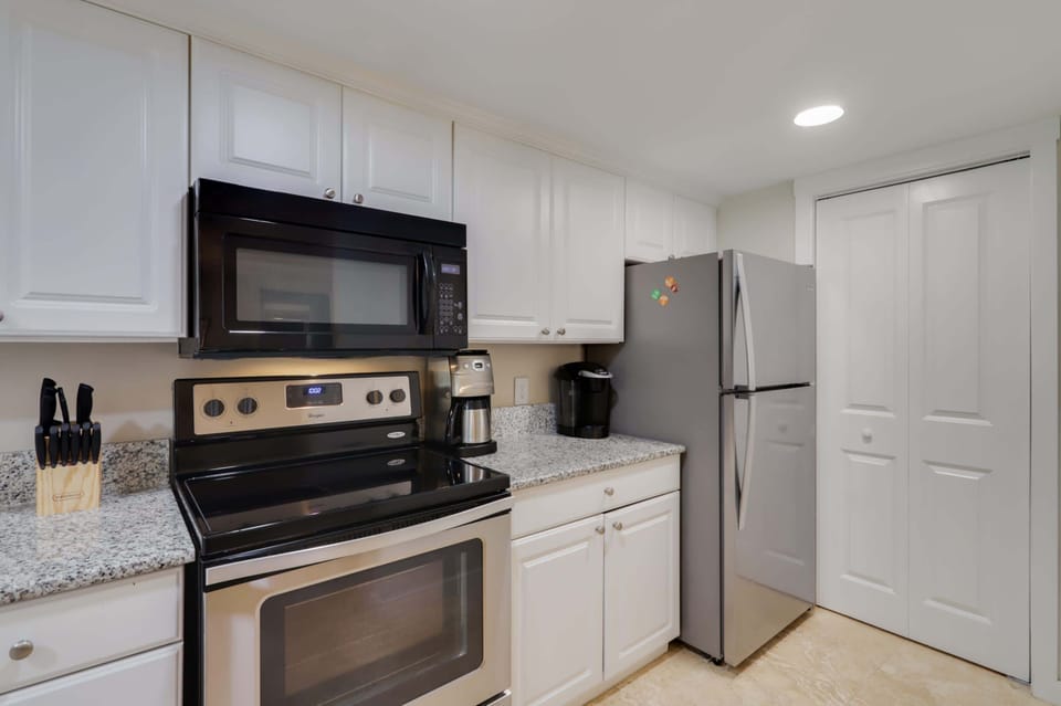 Kitchen Comes Complete With All Cookware Stocked. Stackable Laundry Tucked Away In Closet