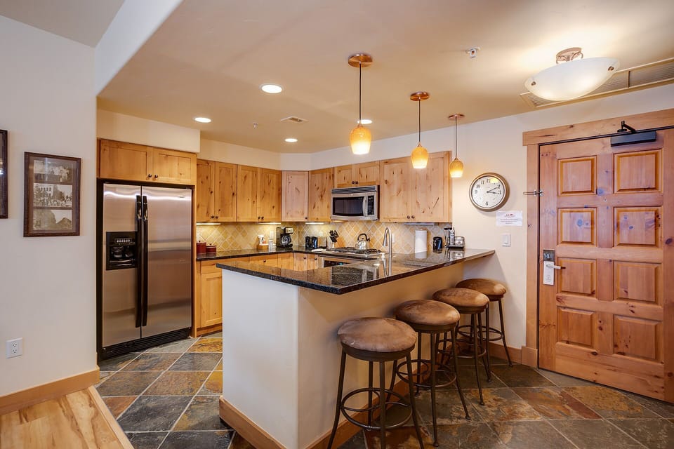 Your gourmet kitchen features granite counters, stainless appliances, and a breakfast bar where you'll savor morning coffee with loved ones.