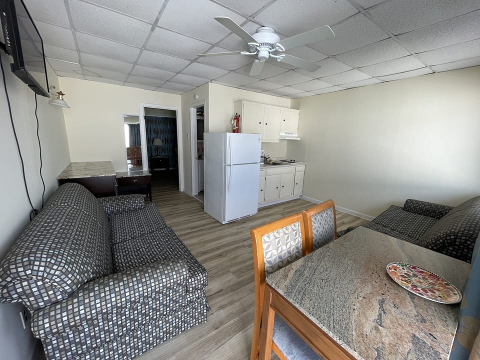 Family Apartment | Living area | 32-inch flat-screen TV with cable channels, TV