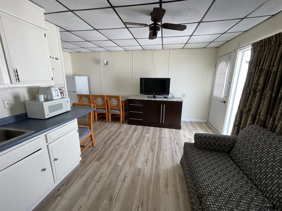 Family Apartment | Living area | 32-inch flat-screen TV with cable channels, TV