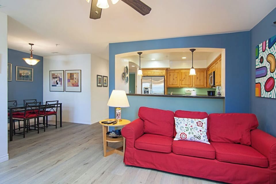 Kitchen opens up to living room and dining area