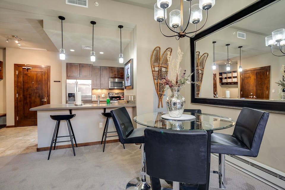 You'll love cooking in your sleek kitchen with modern appliances and gathering around the stylish glass dining table for memorable meals together.