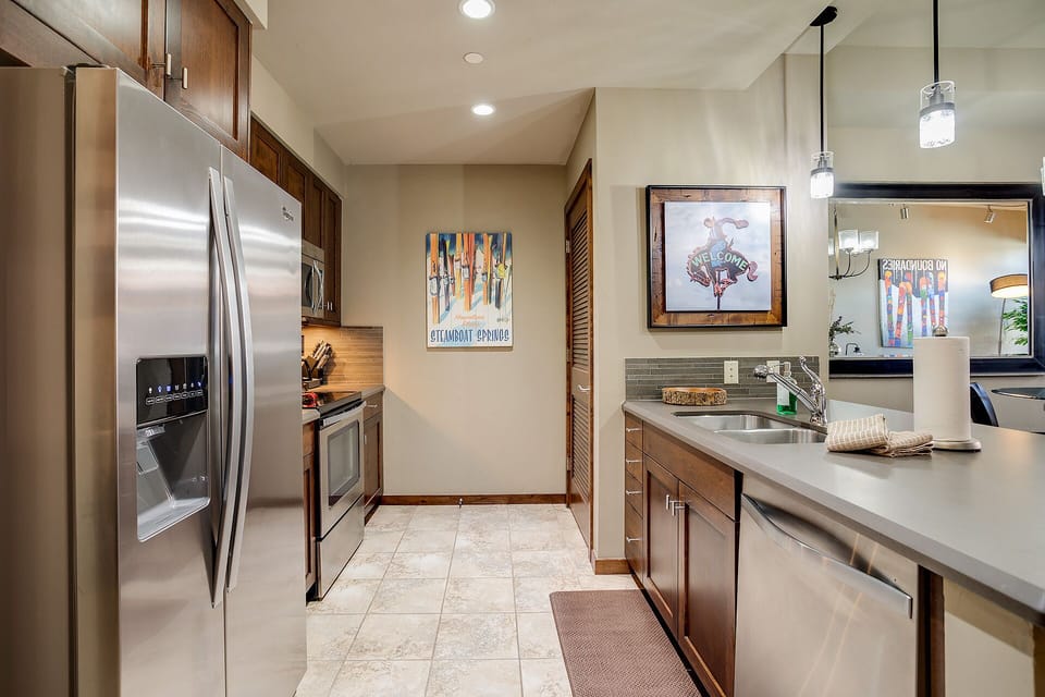 Cook your favorite meals in this modern kitchen with stainless steel appliances, granite counters, and everything you need.