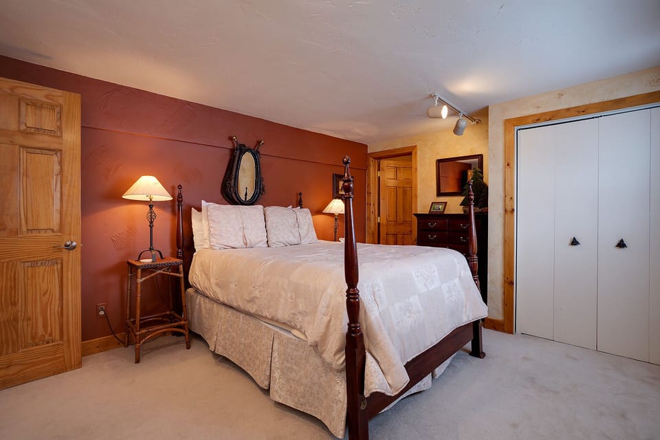 Sink into crisp linens and let the warm, rustic ambiance wrap around you after a day of mountain adventures.