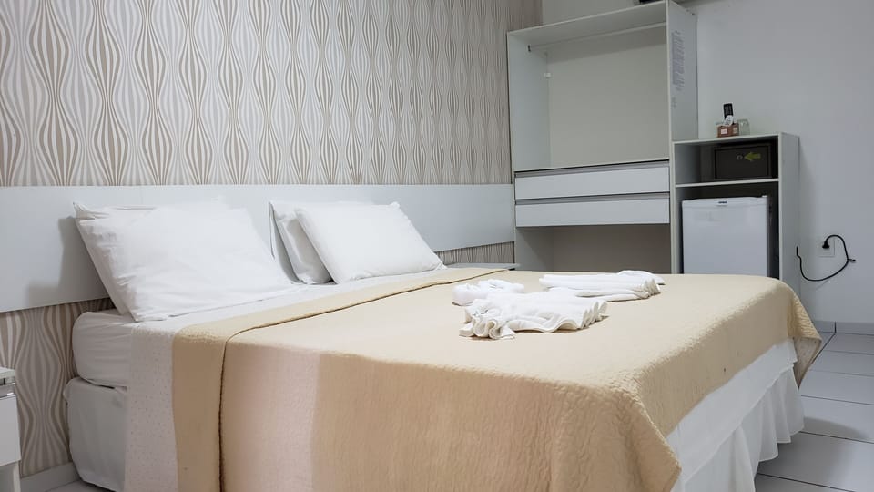 Standard Room | Minibar, in-room safe, individually decorated, desk