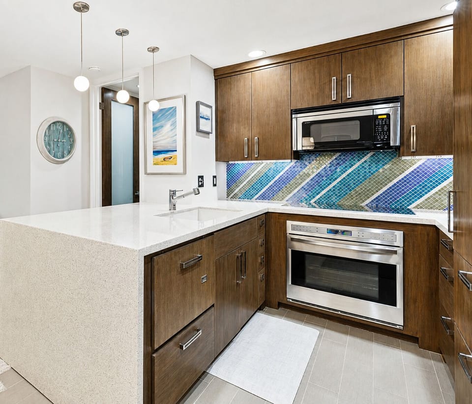 Fisher & Paykel dishwasher, Wolf oven, and Keurig coffee maker