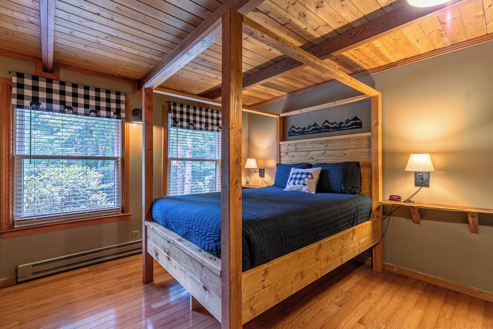 Drift off in the cozy four-poster bed with woodland-inspired decor and warm wood finishes throughout.
