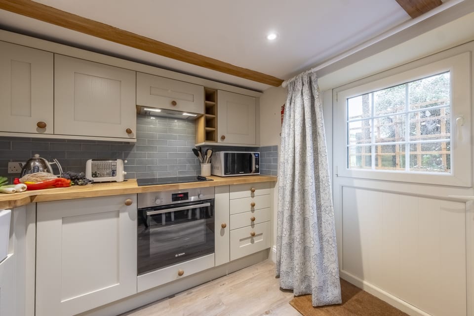 Ground floor: A well-equipped kitchen with barn door