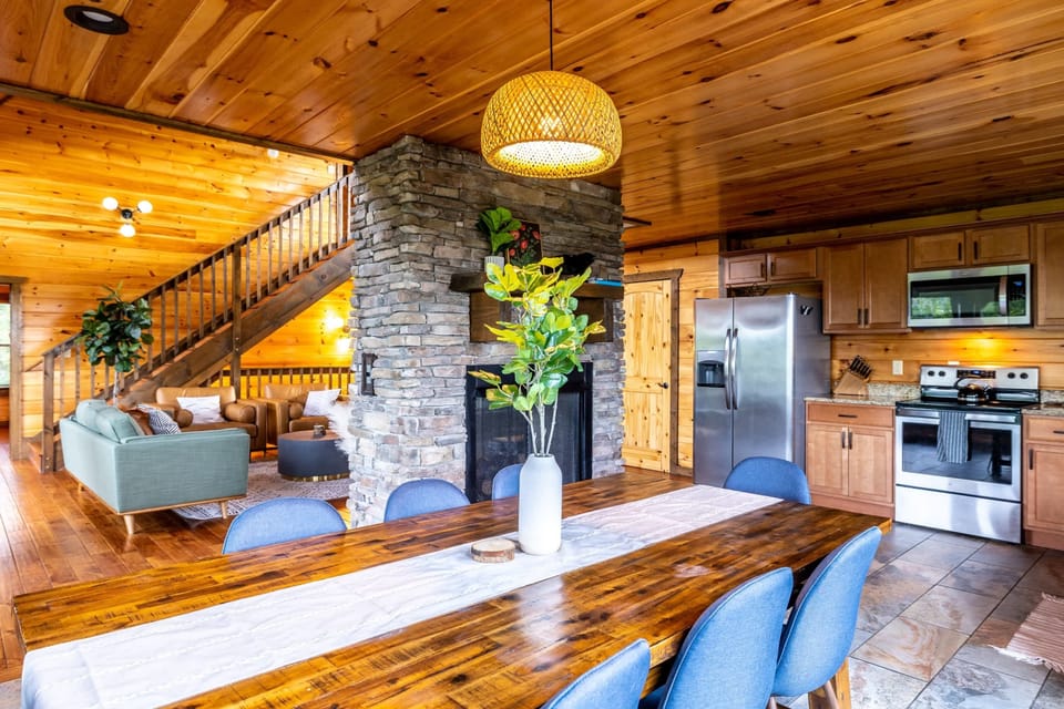 The open floor plan makes for easy and cozy entertaining with the double sided fireplace.