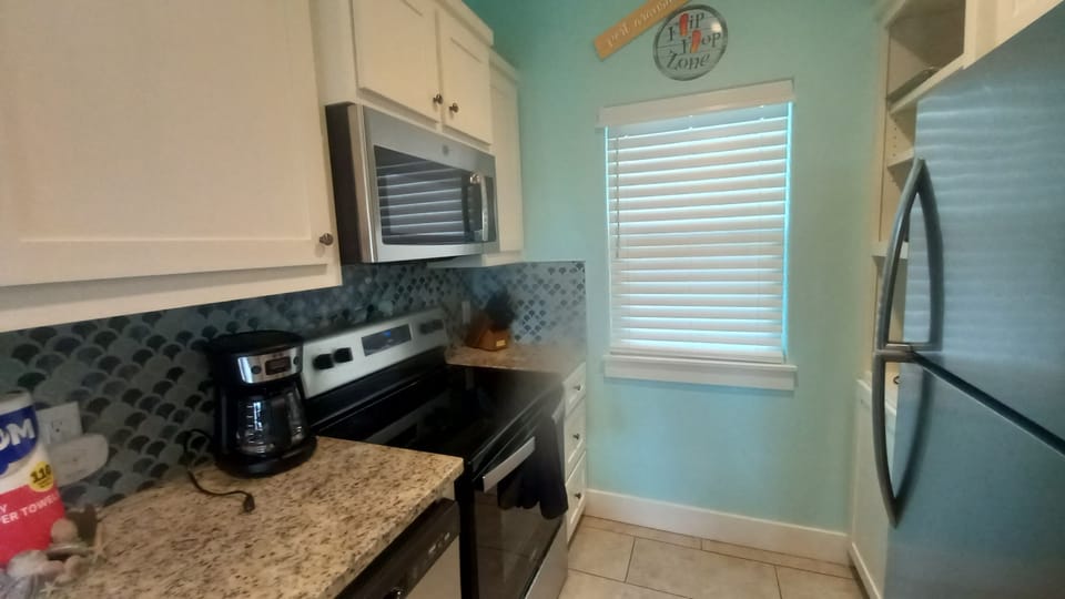 Full sized fridge with microwave and drip coffee pot