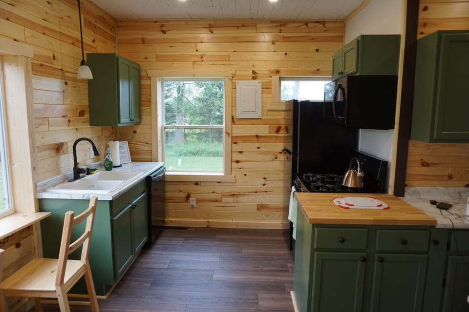 Full kitchen with gas stove, microwave and dishwasher