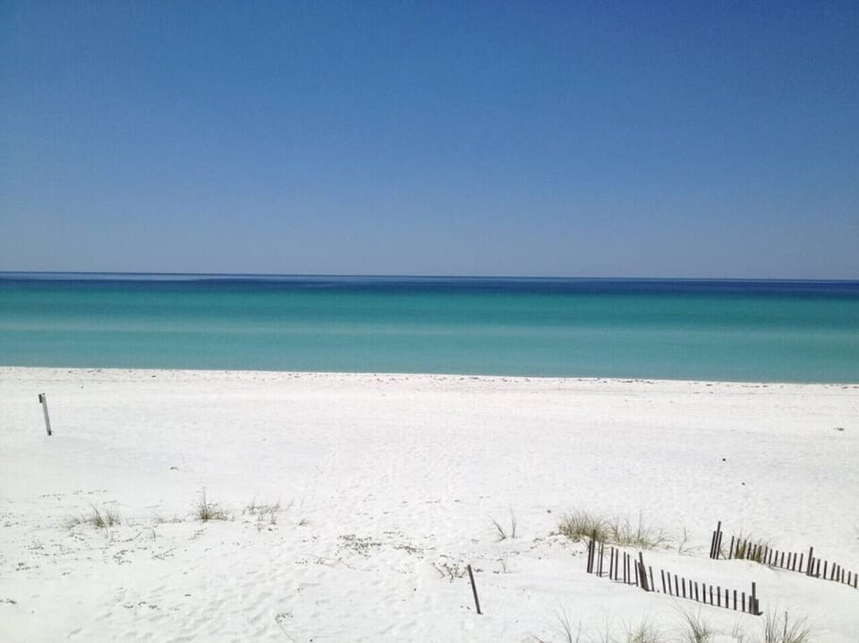 2 Blocks from these beautiful Emeralk Coast waters