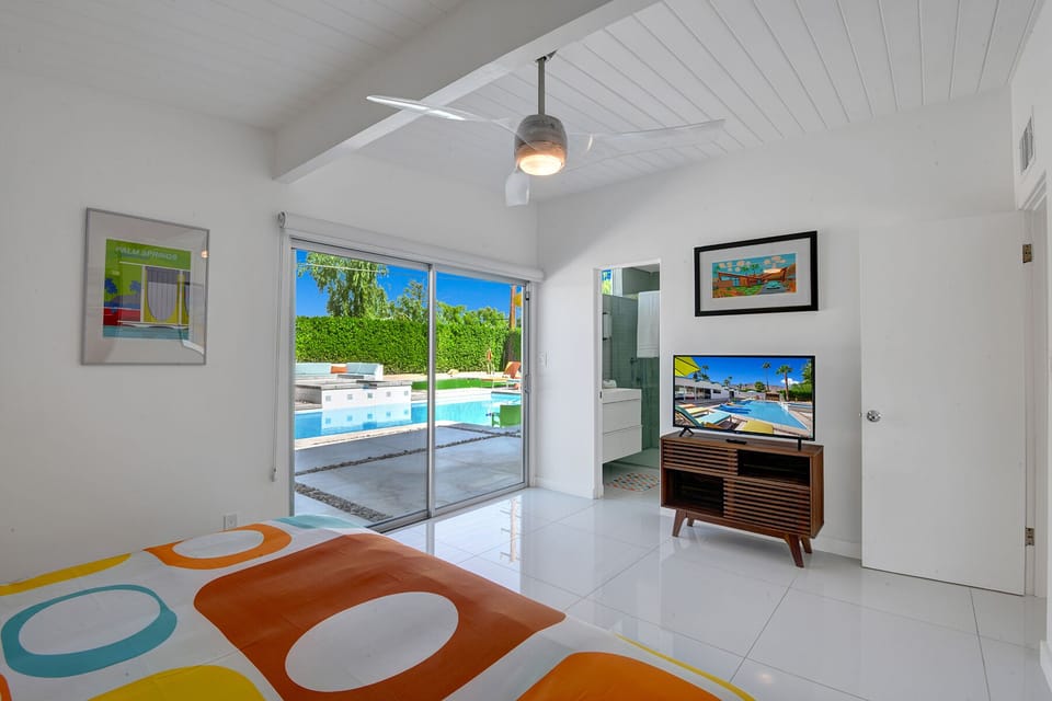 The main bedroom with view of the backyard