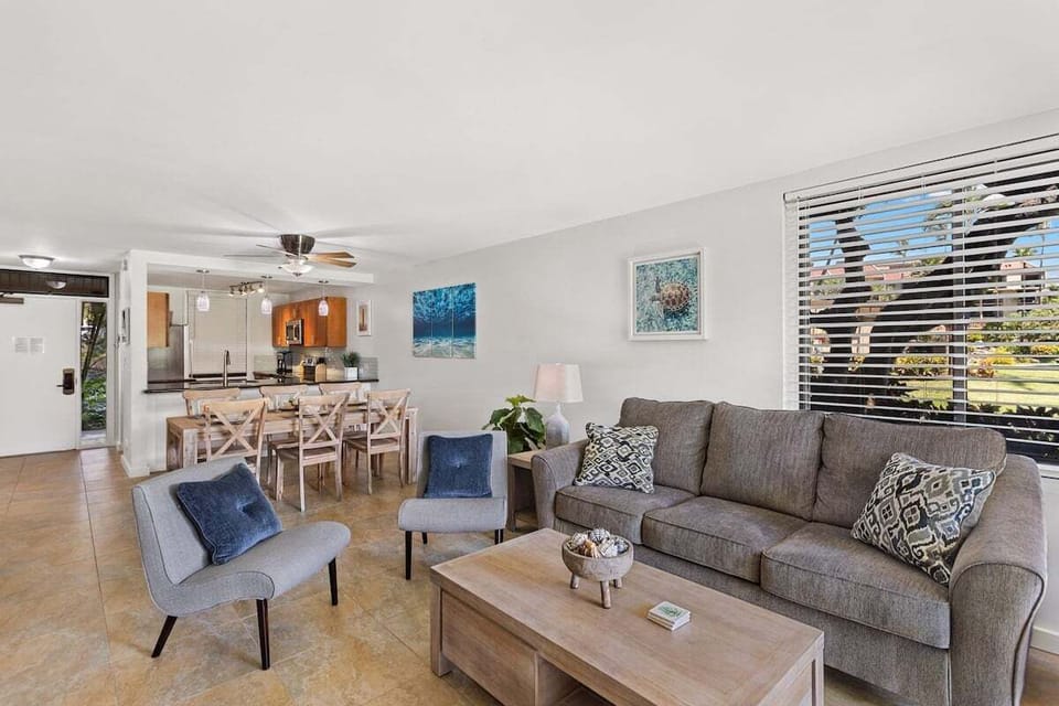 Open-concept layout with cozy lounge, full kitchen, and dining table for eight—perfect for group stays