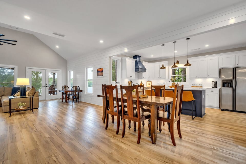 Open kitchen and living room area overlooking lake view 