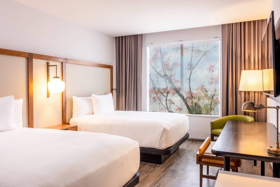 Standard Room, 2 Queen Beds | Hypo-allergenic bedding, minibar, desk, free WiFi