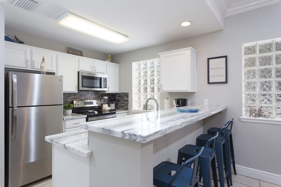 Kitchen area featuring bar seating.