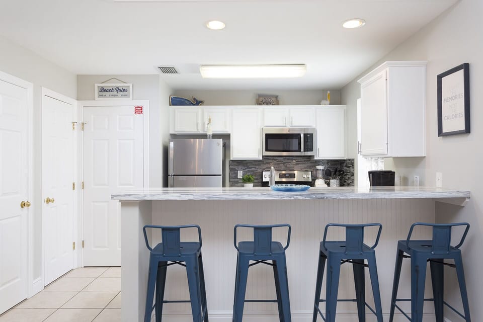 Kitchen area featuring bar seating.