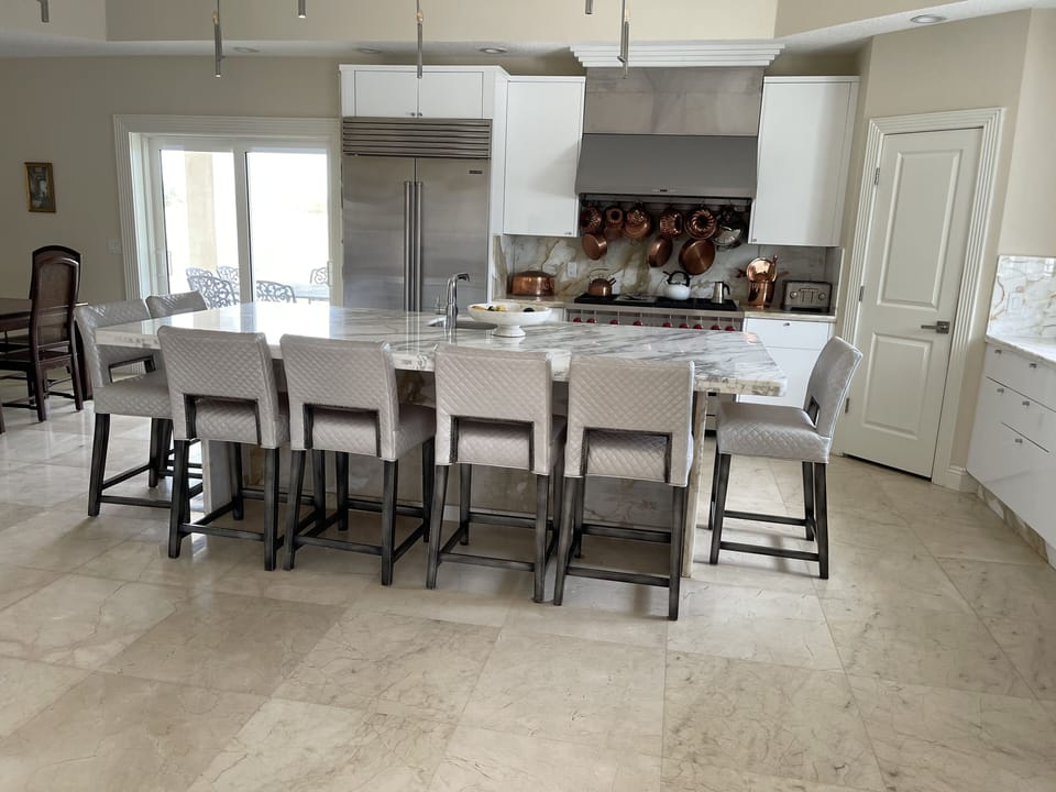 Kitchen with sub-zero refrigerator and Wolf gas burner with six burners.