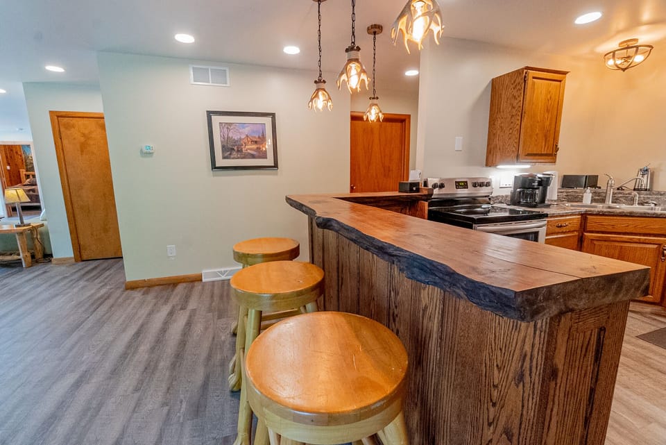 Kitchen - Main Level. Kitchen bar with bar-stools.