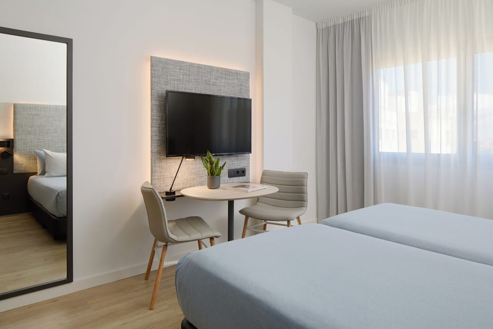 Premium bedding, down comforters, minibar, in-room safe