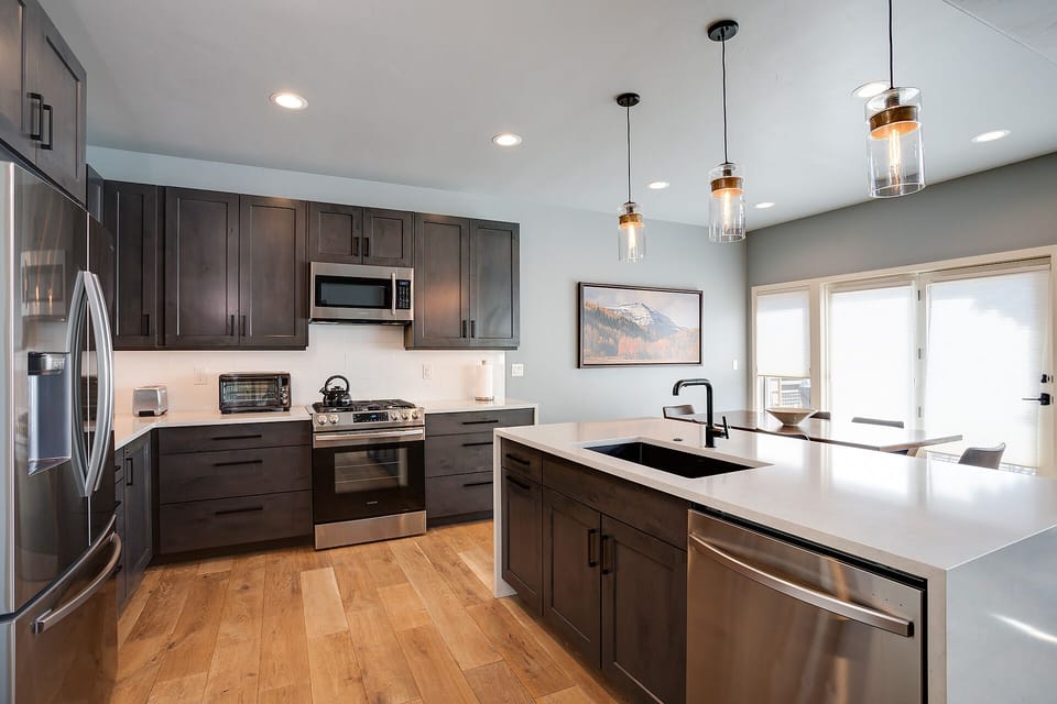 Your gourmet kitchen features sleek cabinets, granite counters, and top-tier appliances for memorable culinary adventures.
