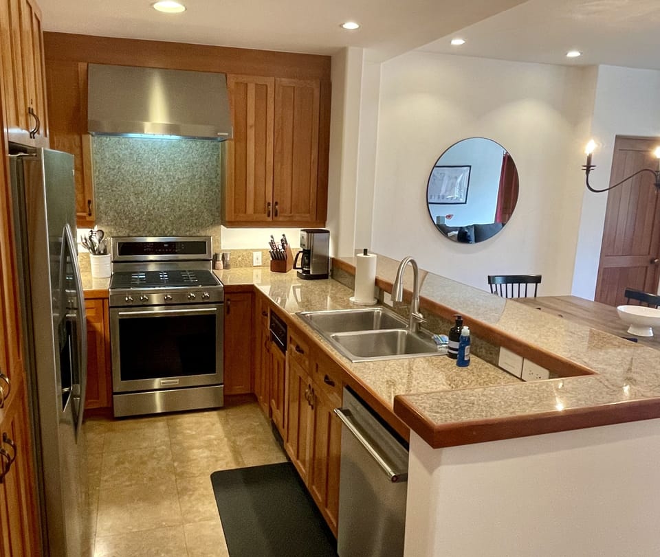 Kitchen opens to dining and living area so you don’t miss out on the action. 