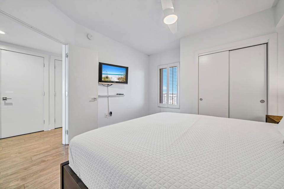 Rest peacefully on your comfortable bed while enjoying your private TV and bright, modern bedroom with plenty of storage.
