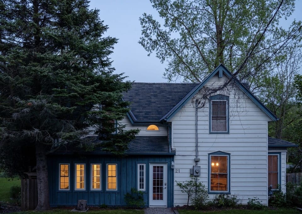 Street view of The Nestled Inn at magic hour.
