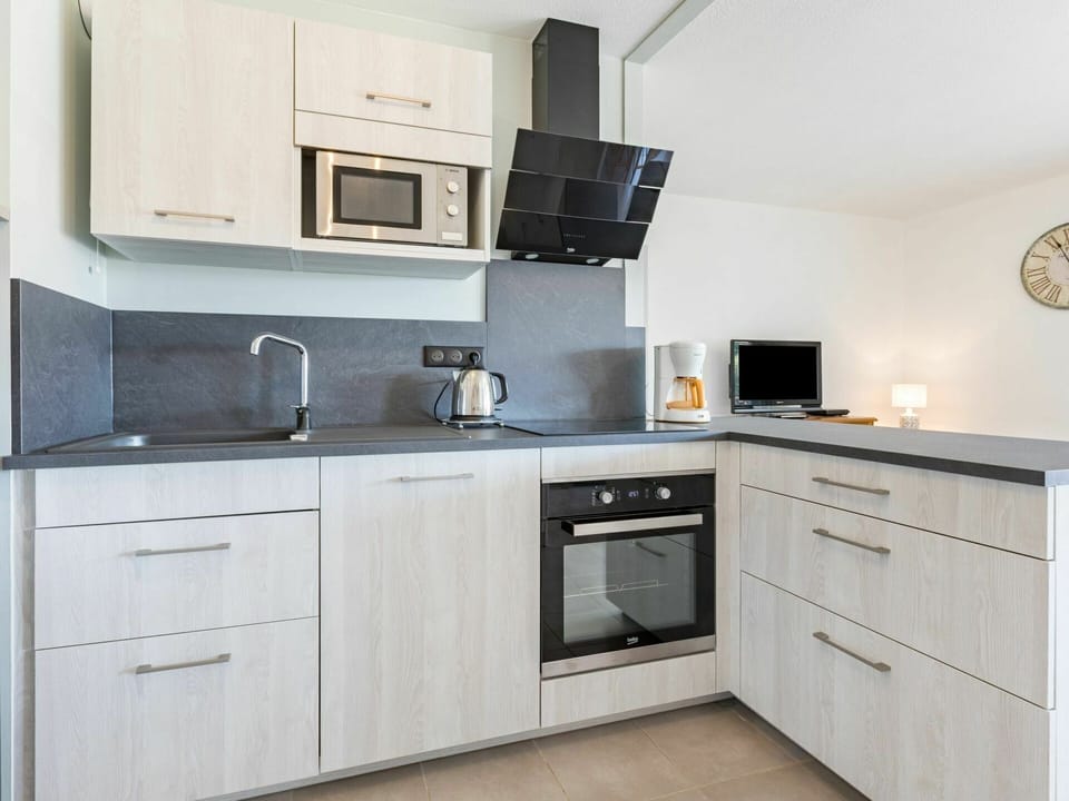 Cabinetry, Kitchen Sink, Countertop, Sink, Kitchen Stove, Building, Kitchen Appliance, Kitchen, Drawer, Wood