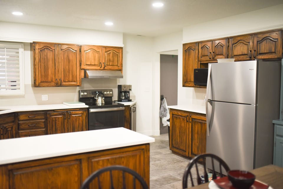 Large Kitchen fully stocked with pots, pans, utensils, spices, dishes, the works