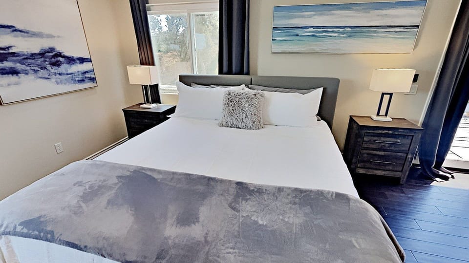 King Size Bed, 2 Bedside Tables, Lamps, Remote Controlled Ceiling Fan, Light and Bright with 2 windows and French Doors with full length Glass windows.