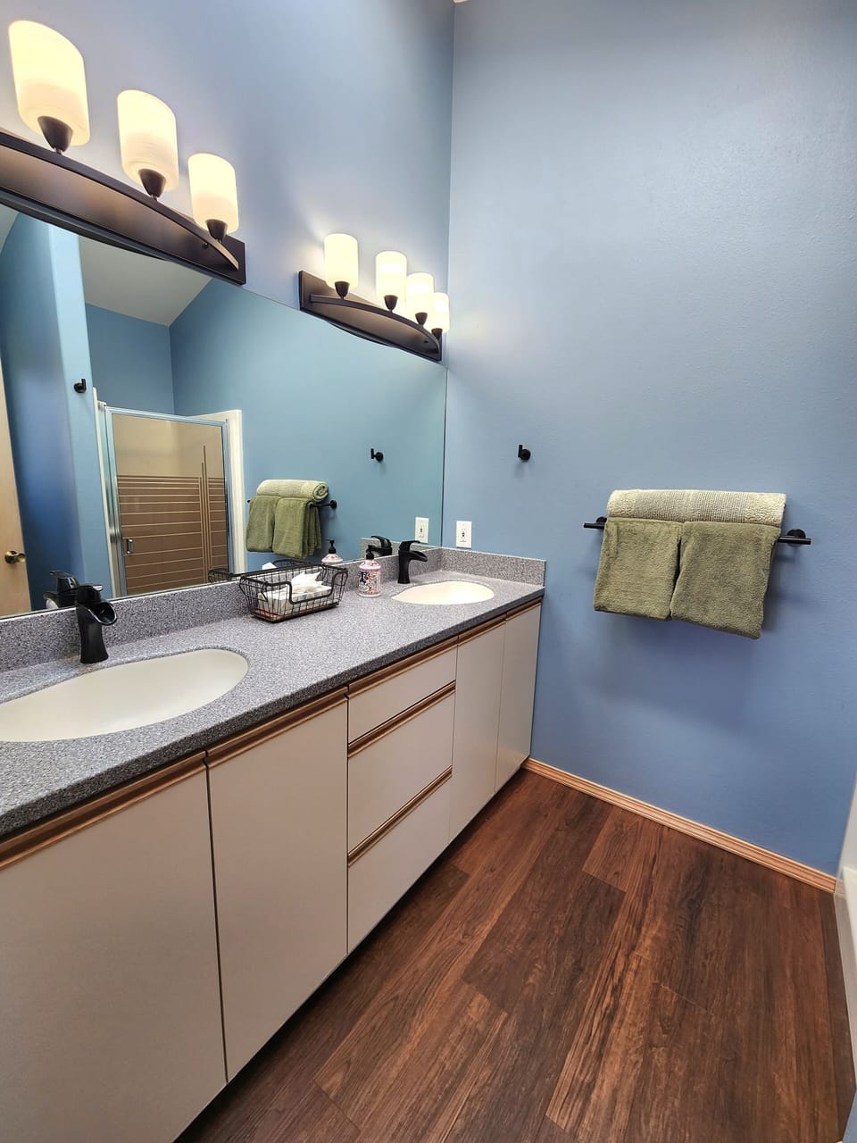 Upper Level Primary Bathroom with double sinks and walk-in shower