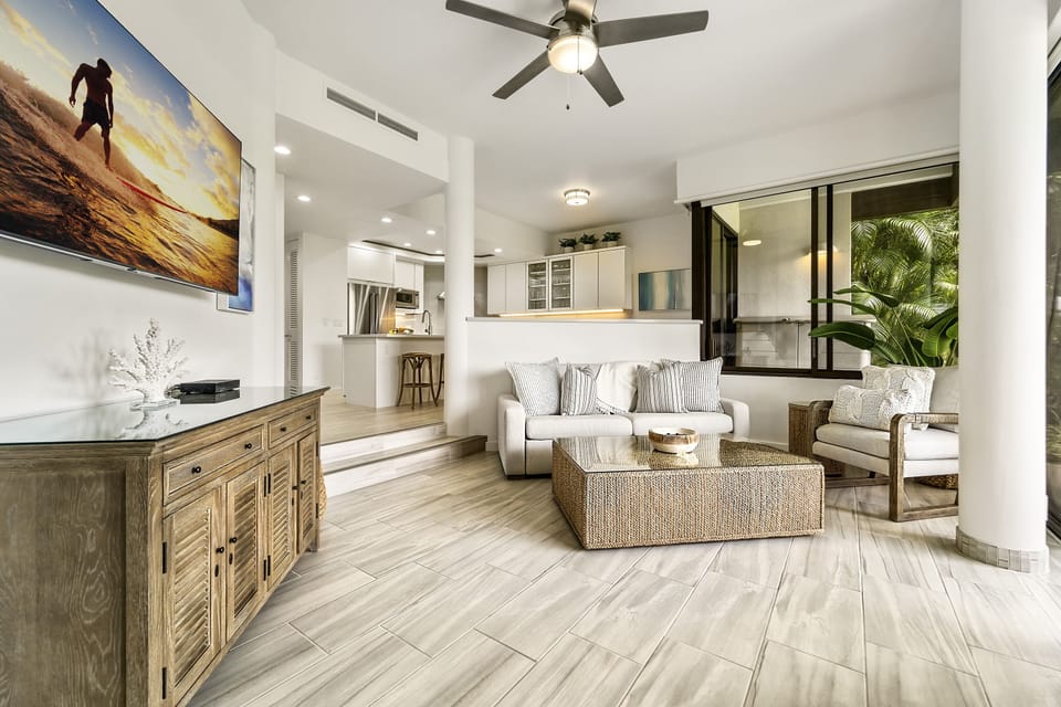 Smart TV, TV Stand, Sofa, Armchair, and Ceiling Fan