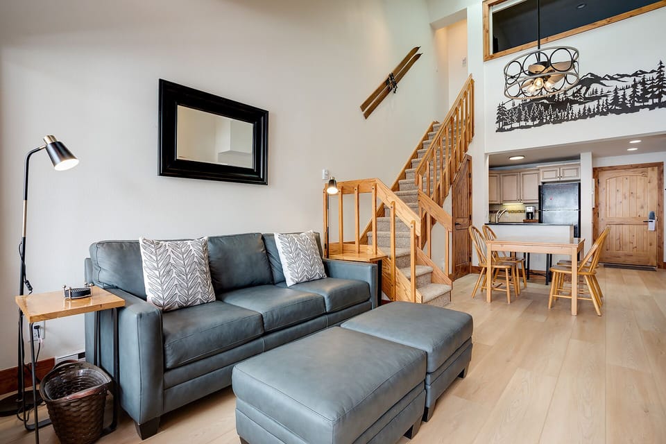 Relax in your spacious living area with comfortable seating, then head upstairs to your private loft retreat.