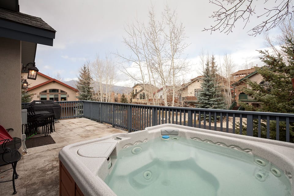 Soak in the steaming hot tub on your private deck, gazing at mountain-view scenery and evergreens. A charcoal grill stands ready for evening cookouts under open skies.