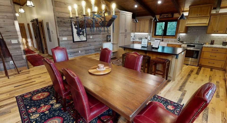 Dining table seats 6 with extra seating at the kitchen island.