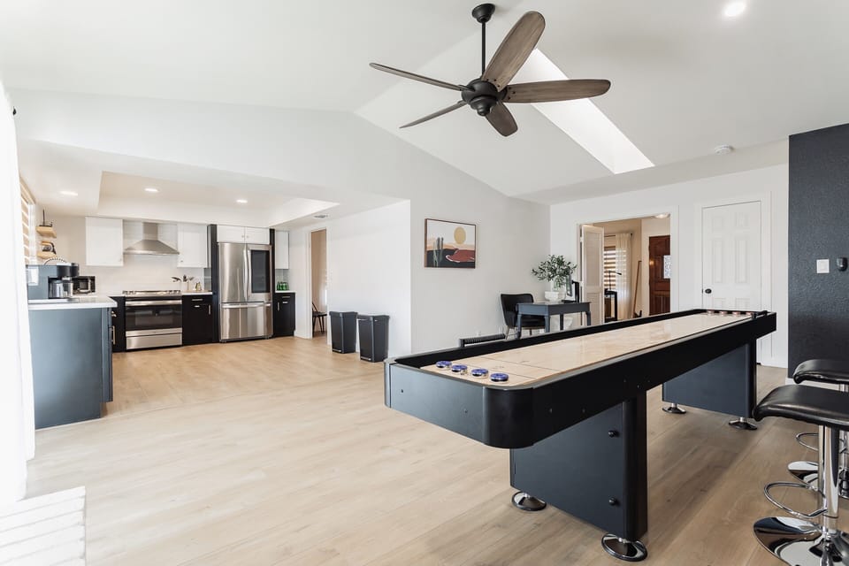Large family room with 12” long shuffleboard table for indoor fun