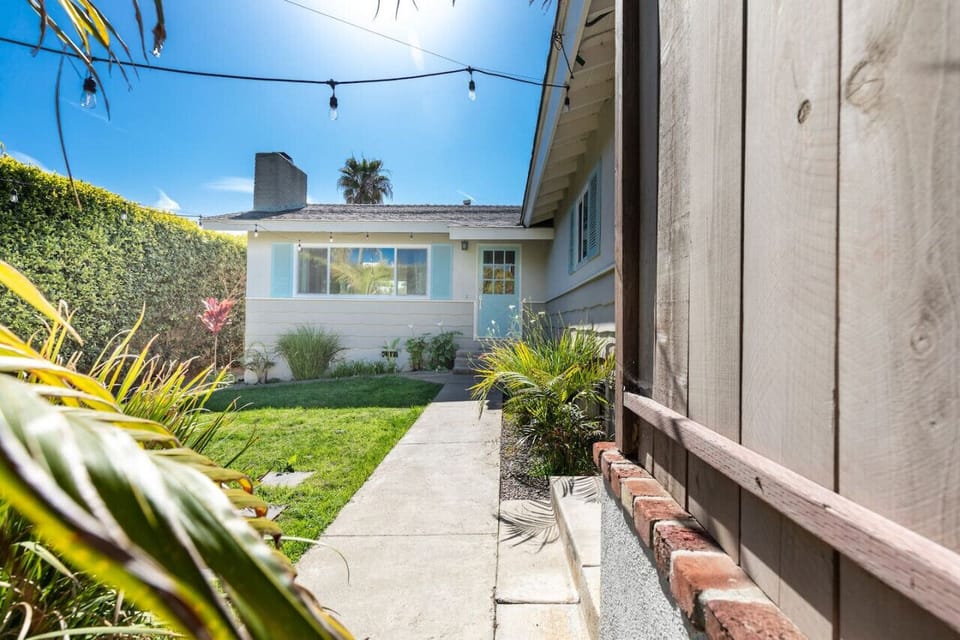 Awesome Front yard with dining tablestring lights