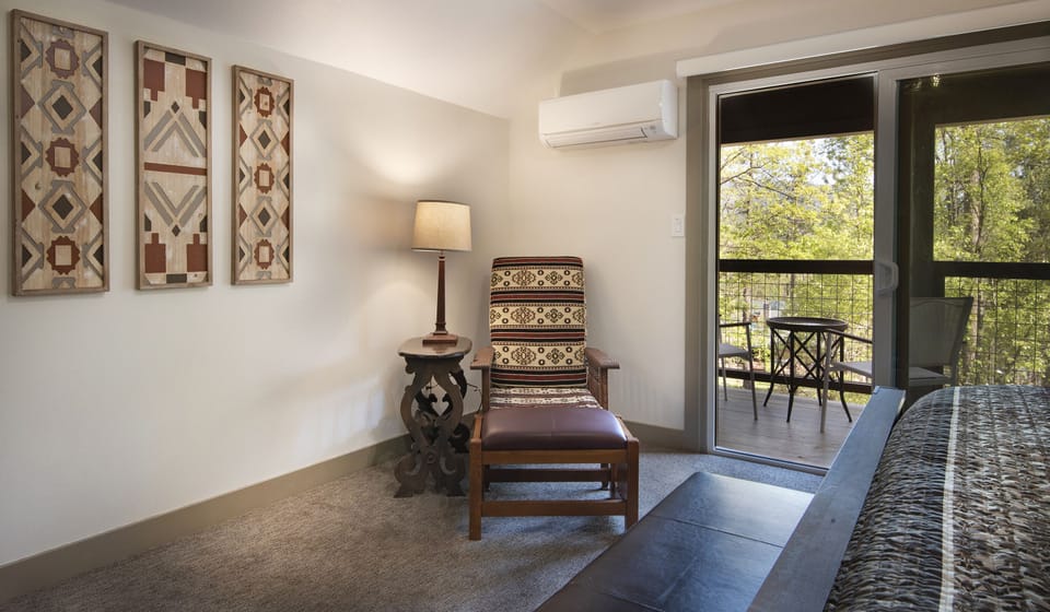 Master bedroom with a private deck