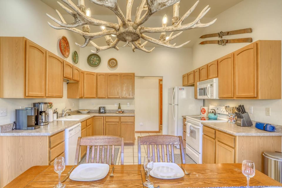 Large eat in Kitchen with Keurig coffee maker and a full standard coffee pot. This fully equipped kitchen has all the essentials of home.